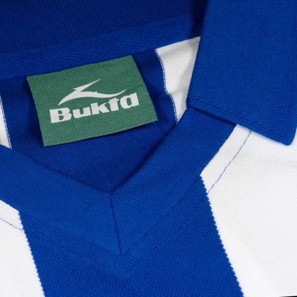 Close up of shirt of Iconic Retro Brighton and hove albion shirt